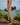 Side view of Maui Rippers Khaki Hybrid Boardshorts in Hawaii