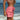 Woman wearing pink womens tangerine lemonade boardshorts