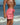 Woman wearing pink womens tangerine lemonade boardshorts