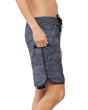 woman putting hand into cargo side pocket of shorts 